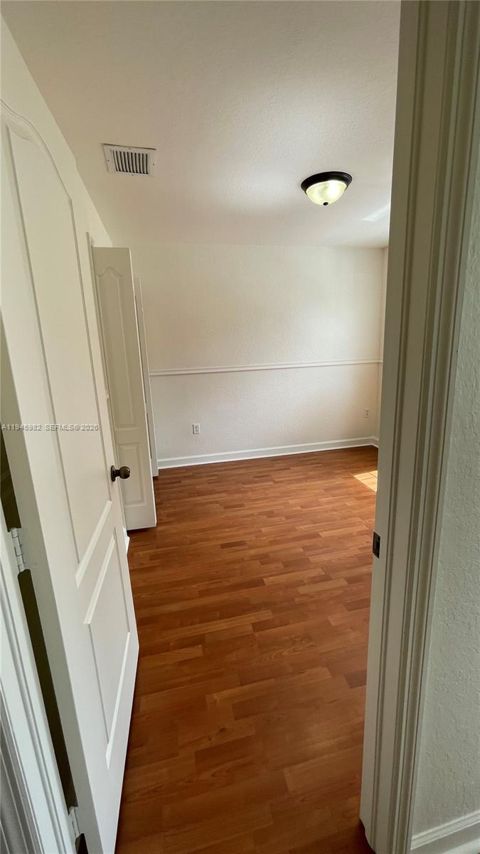 7020 Northwest 177th Street, Unit B103 Hialeah, FL 33015 - Photo 45 of 53 a view of walk in closet