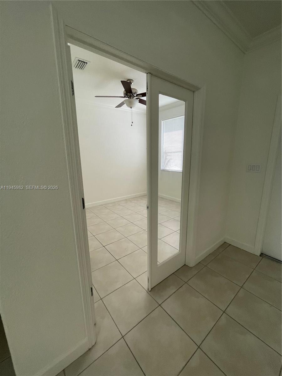 7020 Northwest 177th Street, Unit B103 Hialeah, FL 33015 - Photo 5 of 53 a bathroom with a glass door shower