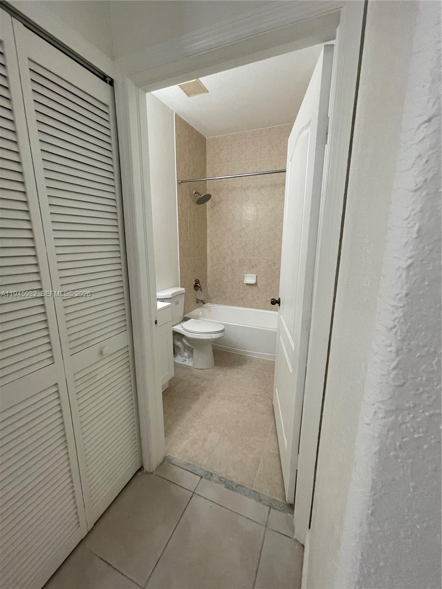 7020 Northwest 177th Street, Unit B103 Hialeah, FL 33015 - Photo 6 of 53 a bathroom with a sink and toilet