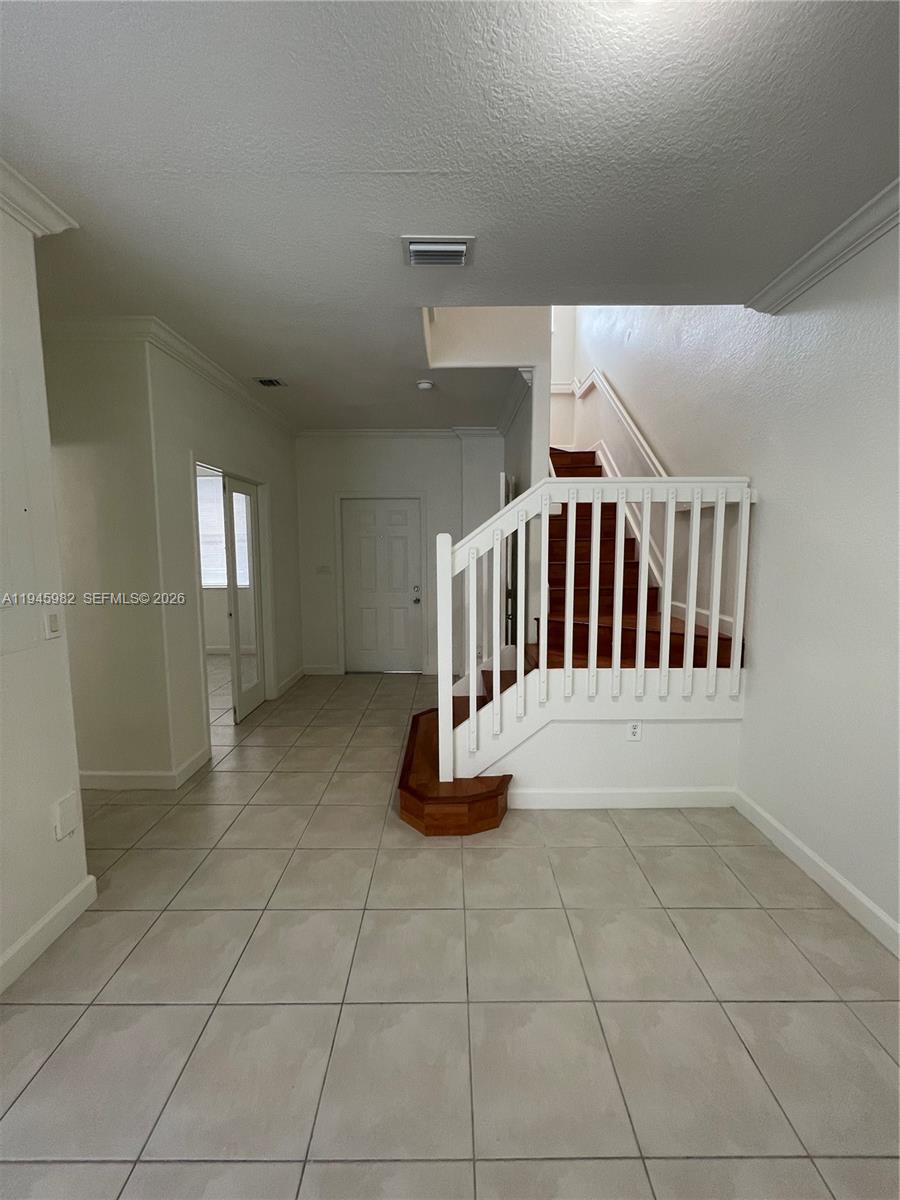 7020 Northwest 177th Street, Unit B103 Hialeah, FL 33015 - Photo 8 of 53 a view of entryway and hall