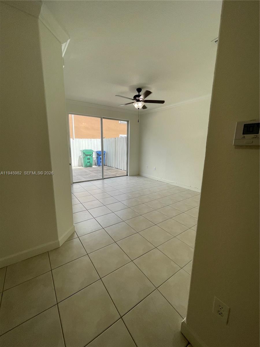 7020 Northwest 177th Street, Unit B103 Hialeah, FL 33015 - Photo 9 of 53 a view of a livingroom and a window