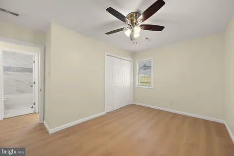 an empty room with fan