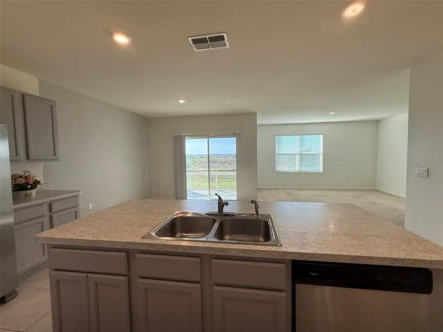 a kitchen with a sink and cabinets