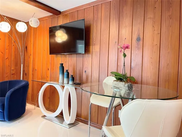 a living room with a couch and a rug