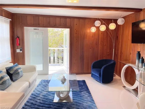 a living room with furniture and a rug