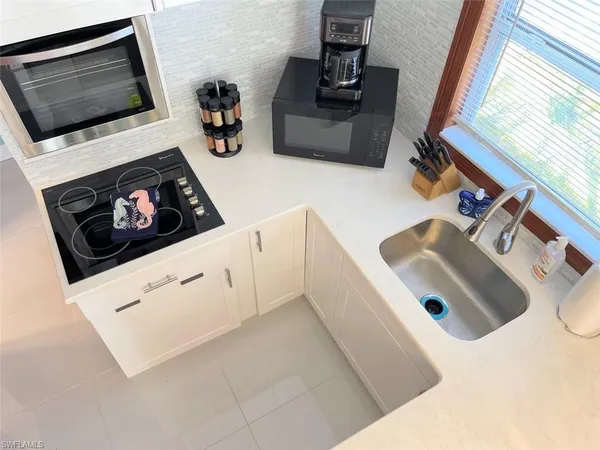 a view of balcony with wooden floor and seating space