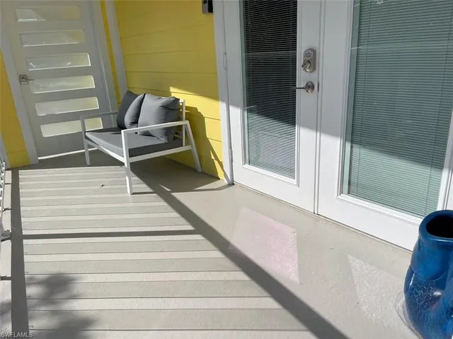 a living room with fireplace furniture and a wooden floor