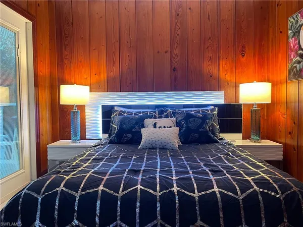 a kitchen with stainless steel appliances a stove a sink and a white cabinets