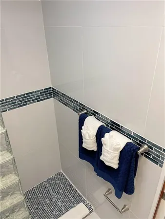 a view of a garden with lawn chairs