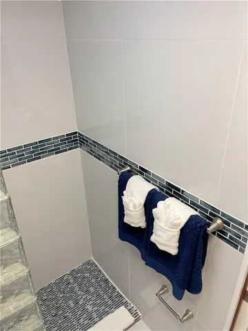 a view of a garden with lawn chairs