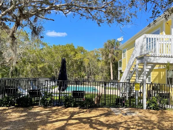 a living room with fireplace furniture and a flat screen tv