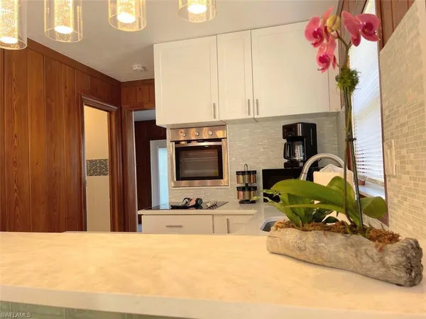 a kitchen with a refrigerator and a sink