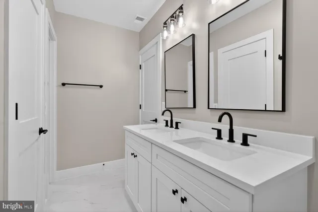 a view of a white house with a yard