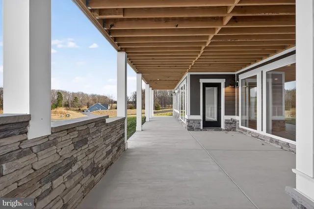a yard with lots of green space and trees