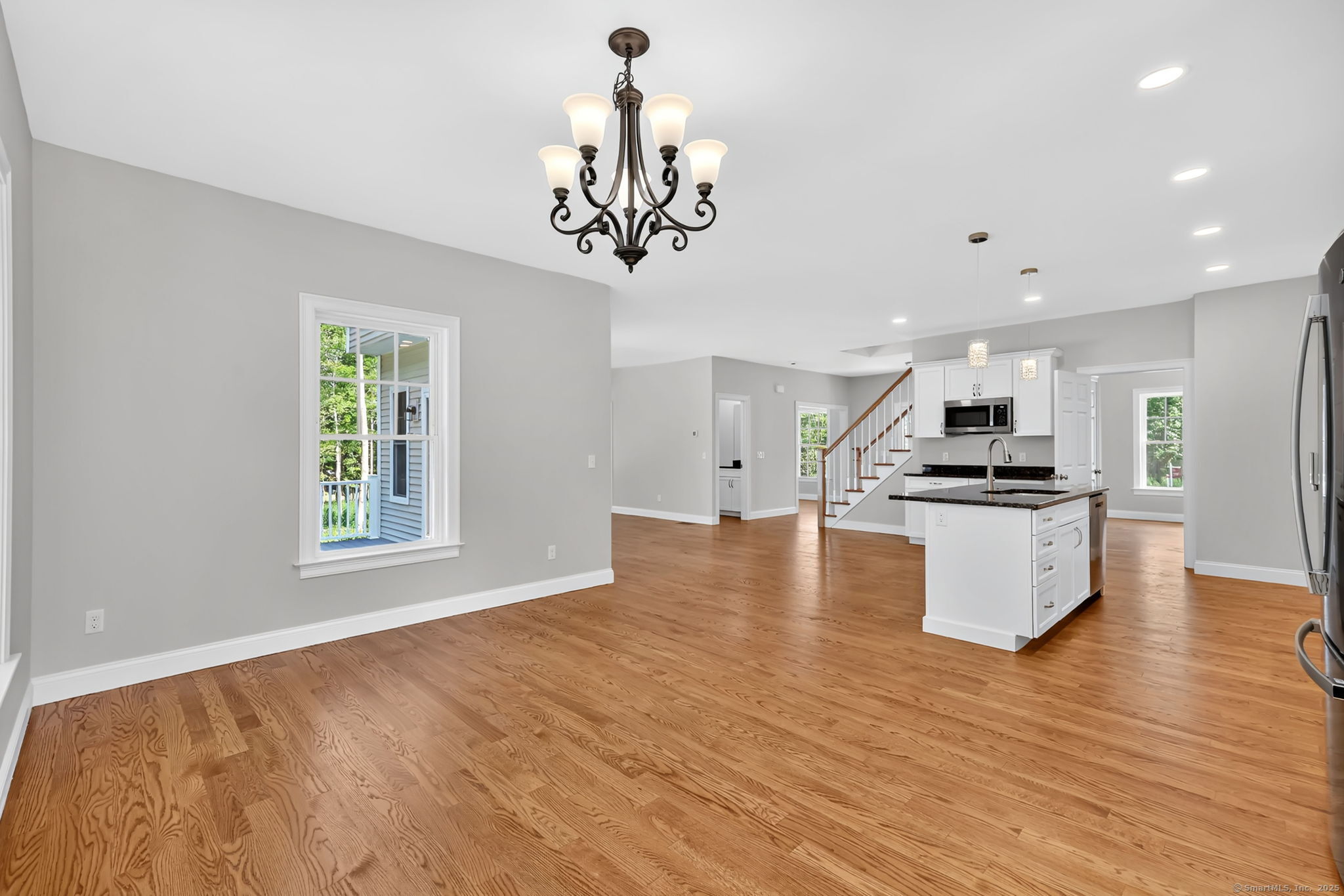 43 Wyllys Farm Road Storrs Mansfield, CT 06268 - Photo 13 of 40 a kitchen with kitchen island white cabinets and stainless steel appliances