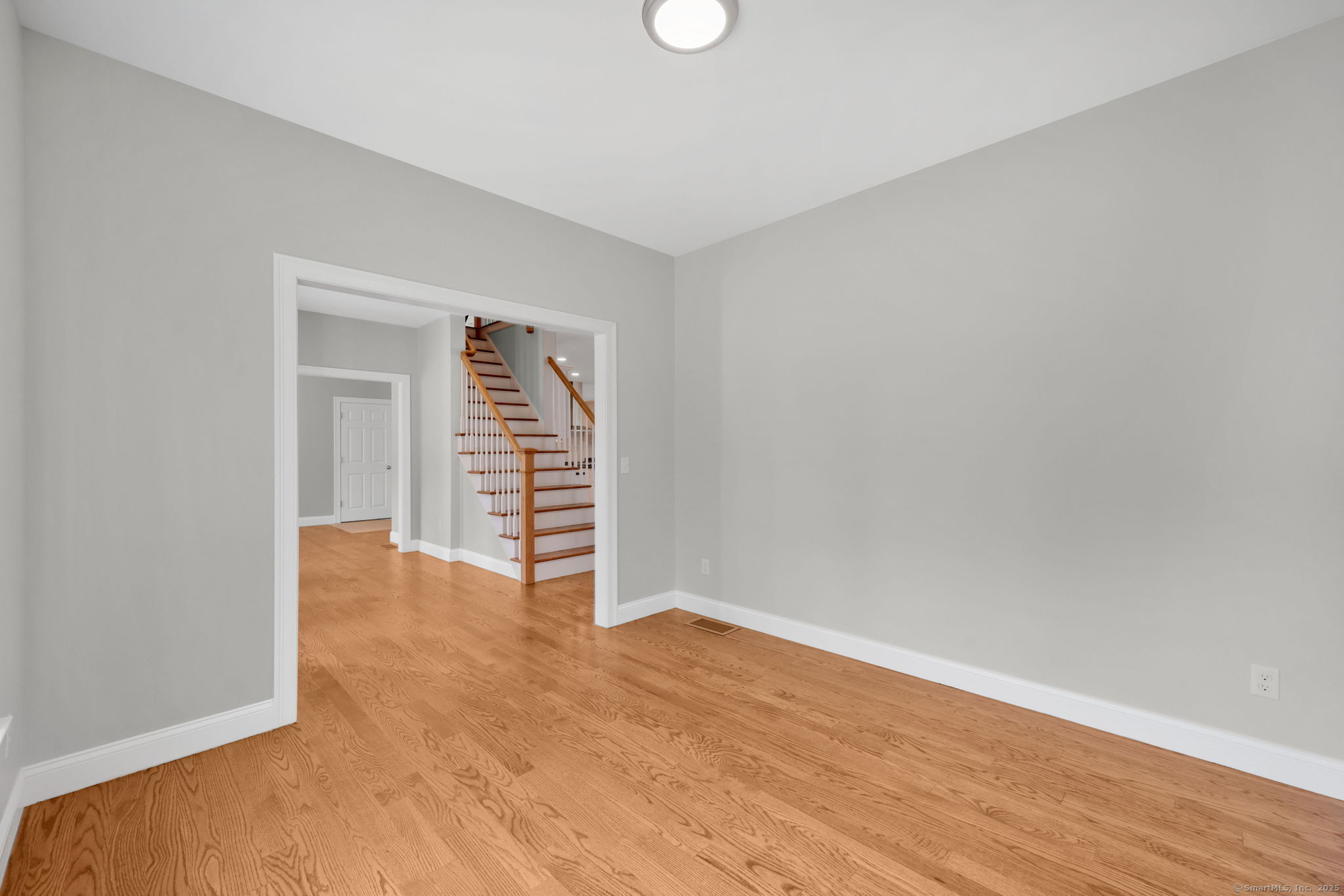 43 Wyllys Farm Road Storrs Mansfield, CT 06268 - Photo 19 of 40 a view of an empty room with wooden floor and a window