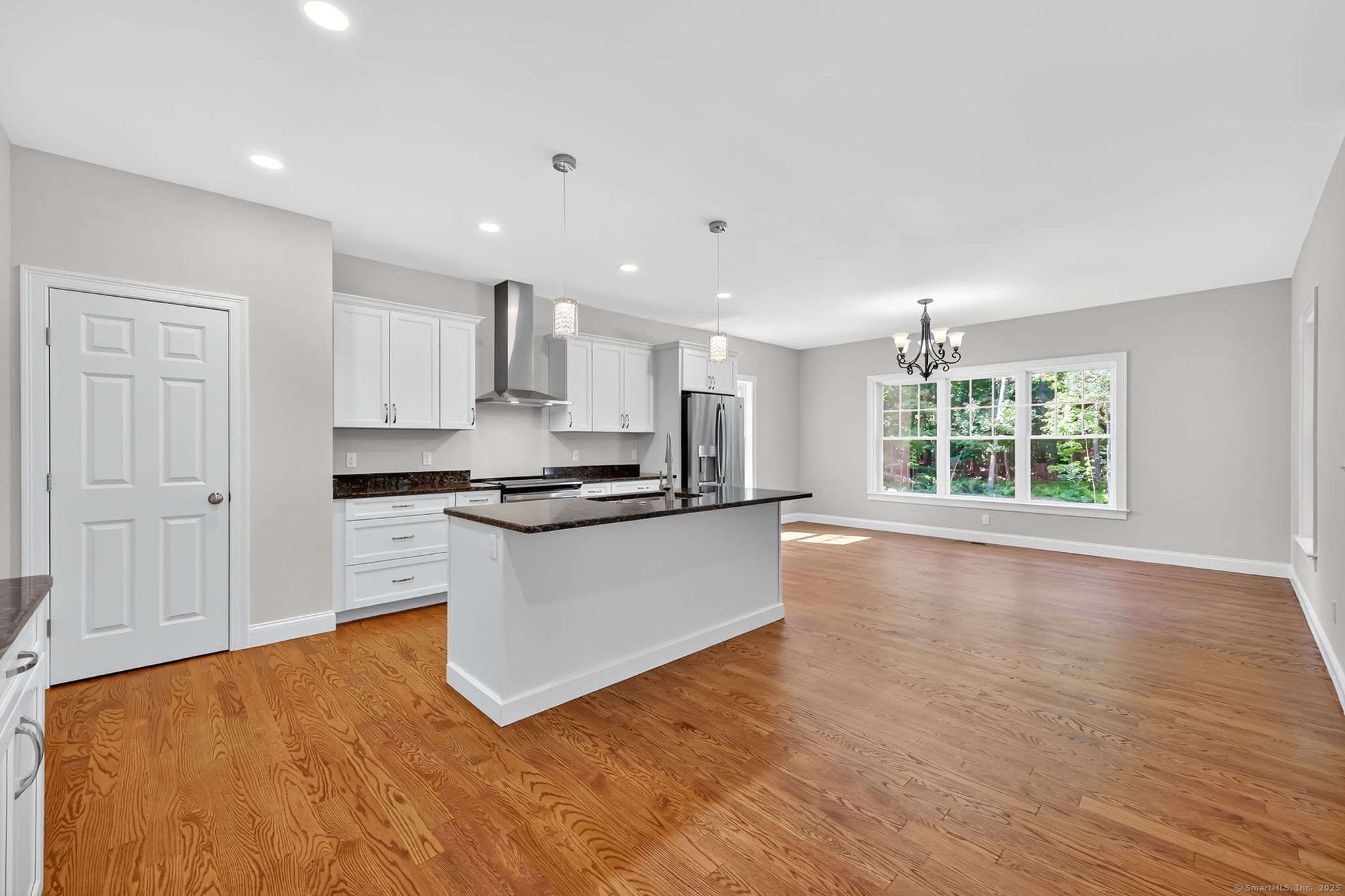 43 Wyllys Farm Road Storrs Mansfield, CT 06268 - Photo 9 of 40 a large kitchen with stainless steel appliances granite countertop a stove a sink and a large window
