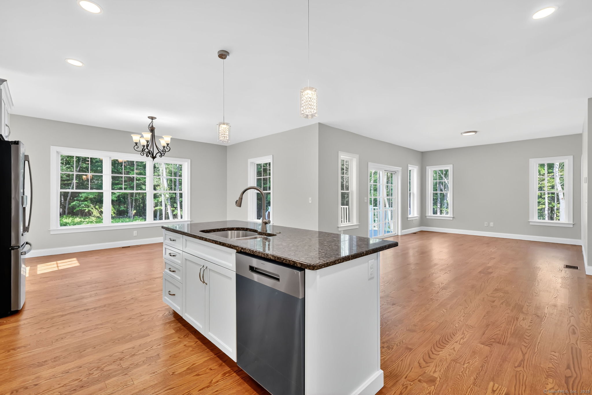 43 Wyllys Farm Road Storrs Mansfield, CT 06268 - Photo 10 of 40 a kitchen with granite countertop a stove and a wooden floors