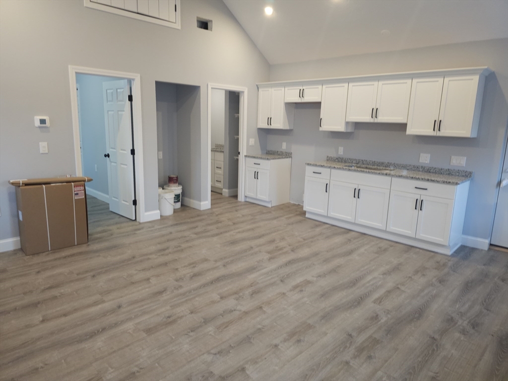 32 West Street, Unit 3 Middleboro, MA 02346 - Photo 1 of 8 a kitchen with stainless steel appliances granite countertop a refrigerator sink and cabinets