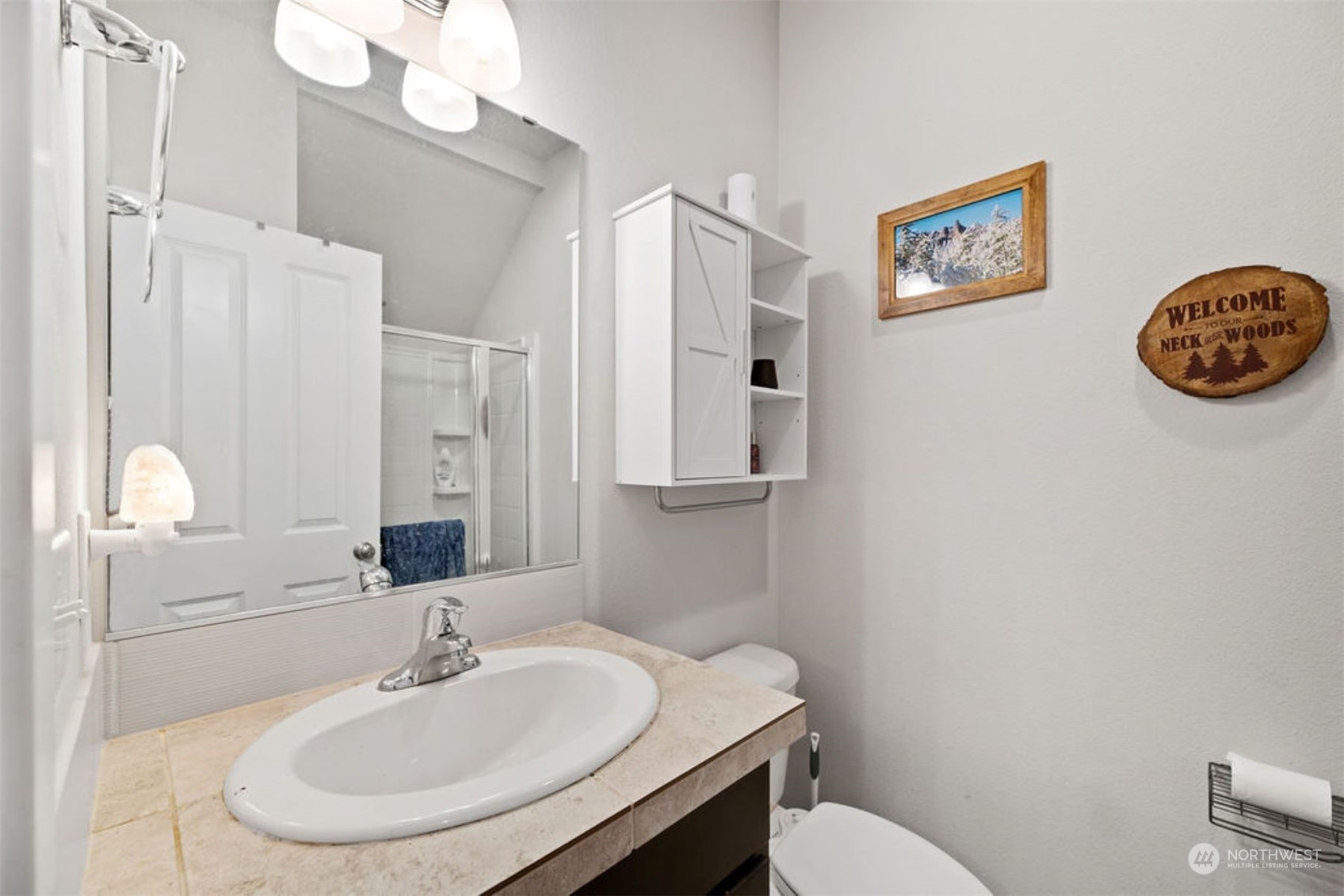 10305 Messner Avenue Granite Falls, WA 98252 - Photo 13 of 23 a bathroom with a sink a toilet and a mirror
