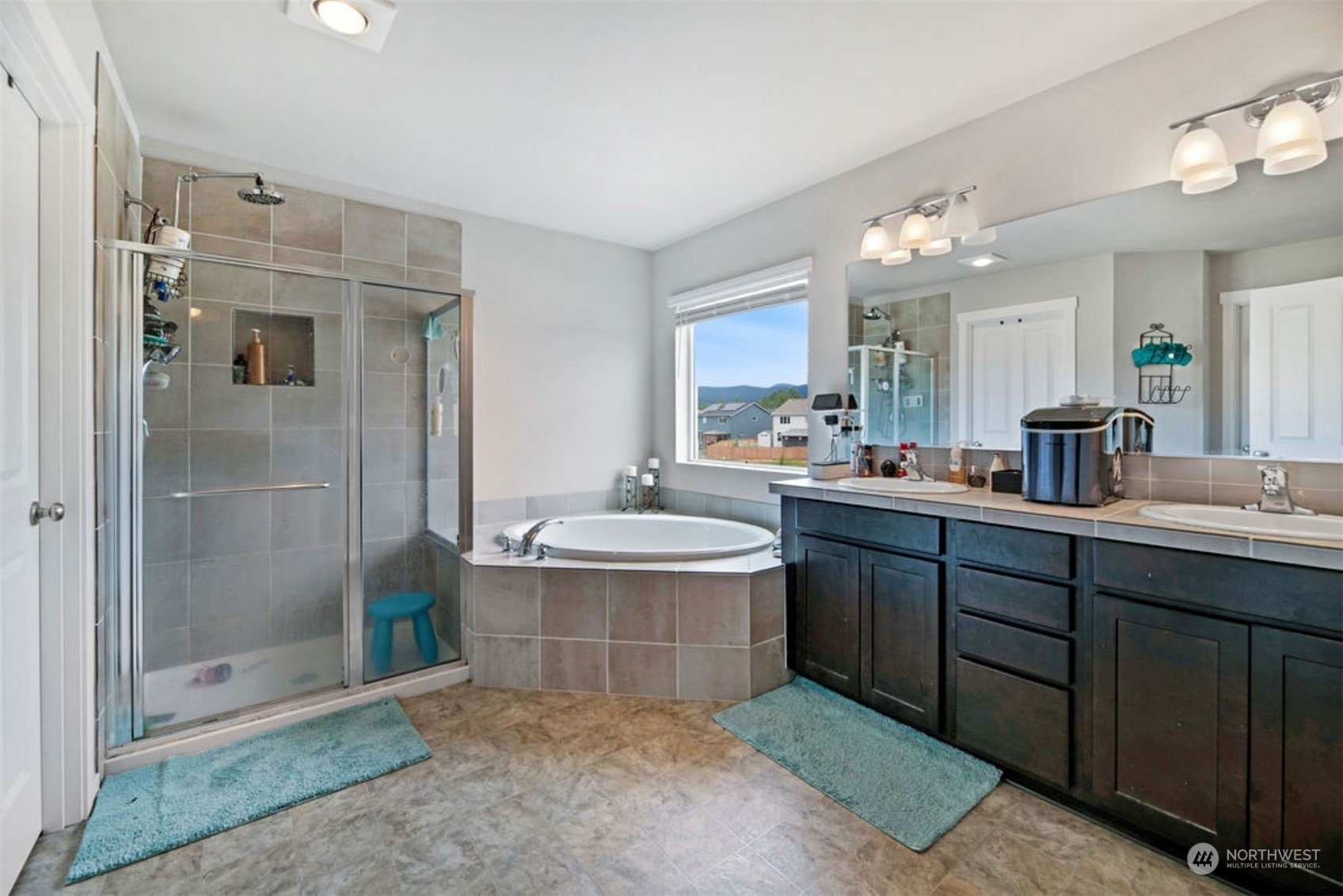 10305 Messner Avenue Granite Falls, WA 98252 - Photo 17 of 23 a bathroom with a tub sink shower and mirror