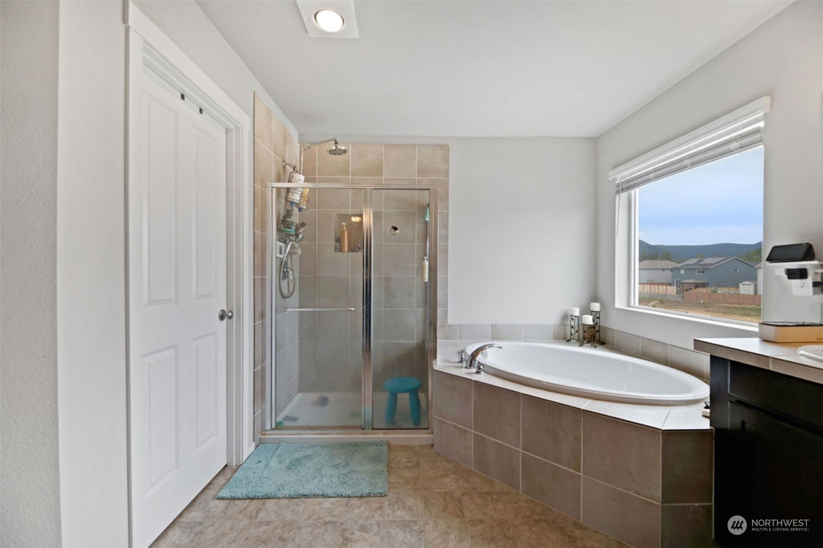 10305 Messner Avenue Granite Falls, WA 98252 - Photo 18 of 23 a bathroom with a double vanity sink a mirror and a shower