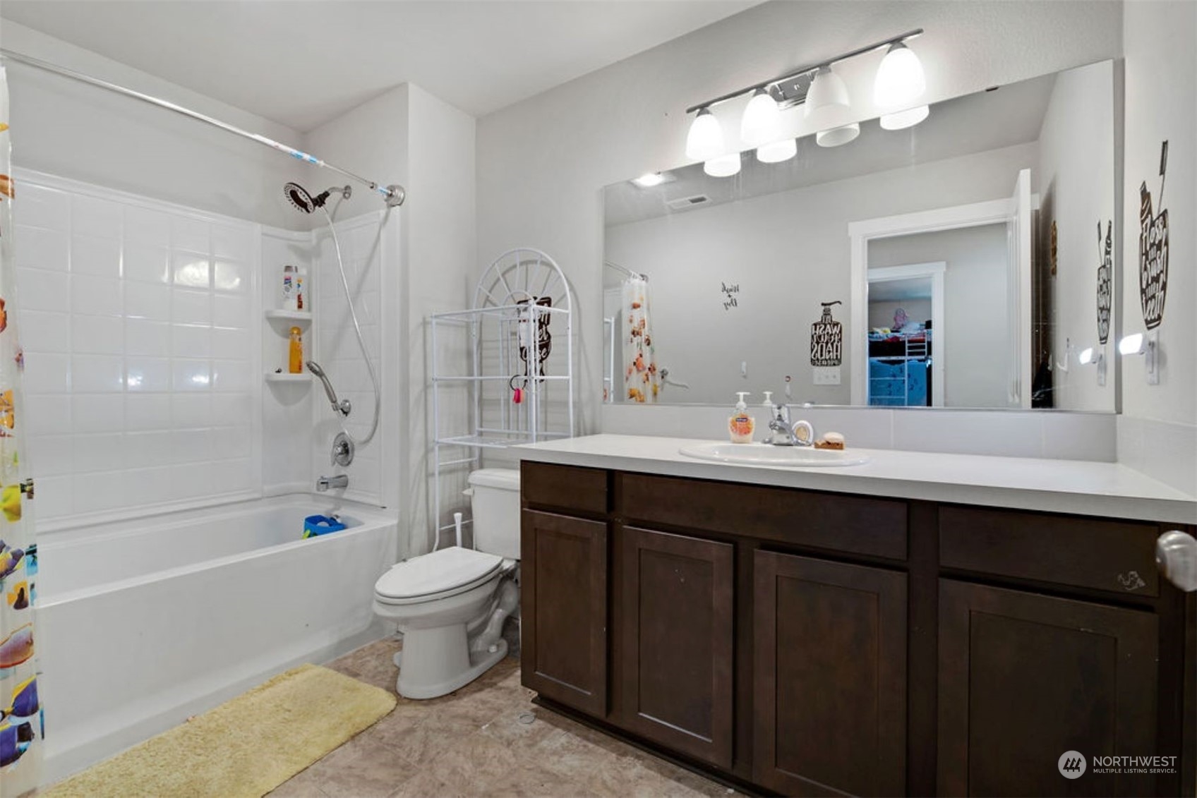 10305 Messner Avenue Granite Falls, WA 98252 - Photo 22 of 23 a bathroom with a double vanity sink toilet mirror and shower