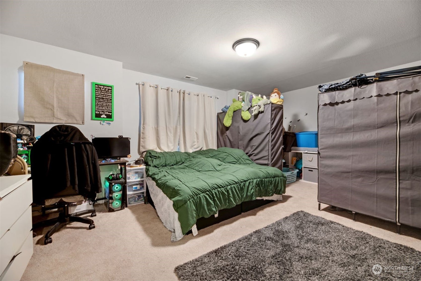 10305 Messner Avenue Granite Falls, WA 98252 - Photo 23 of 23 a bedroom with a bed and a walk in closet