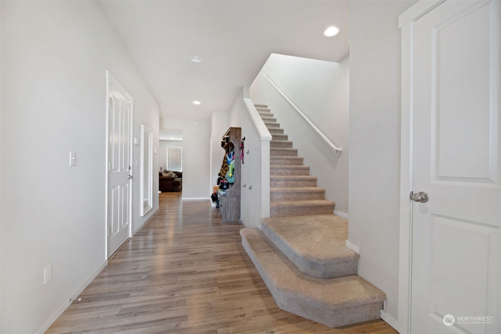 10305 Messner Avenue Granite Falls, WA 98252 - Photo 6 of 23 a view of a hallway with wooden floor and staircase
