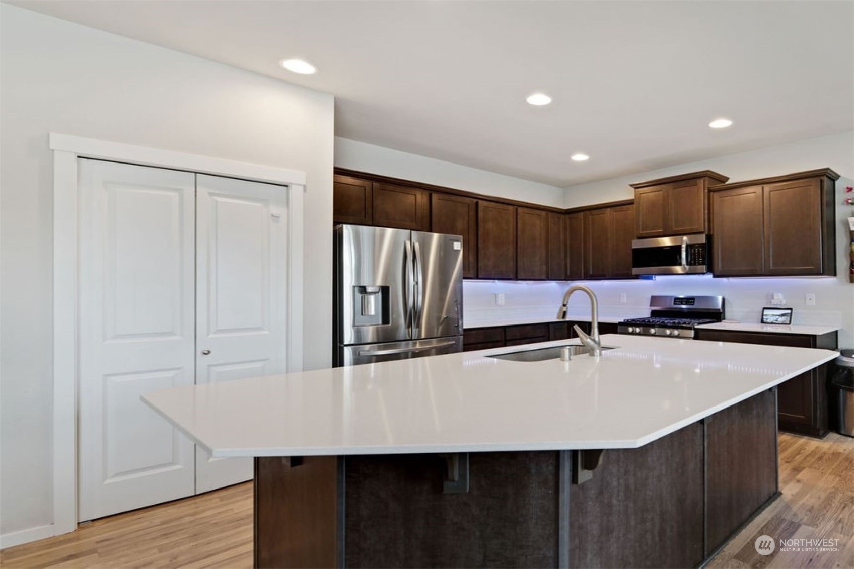 10305 Messner Avenue Granite Falls, WA 98252 - Photo 7 of 23 a kitchen with kitchen island a counter top space cabinets and stainless steel appliances