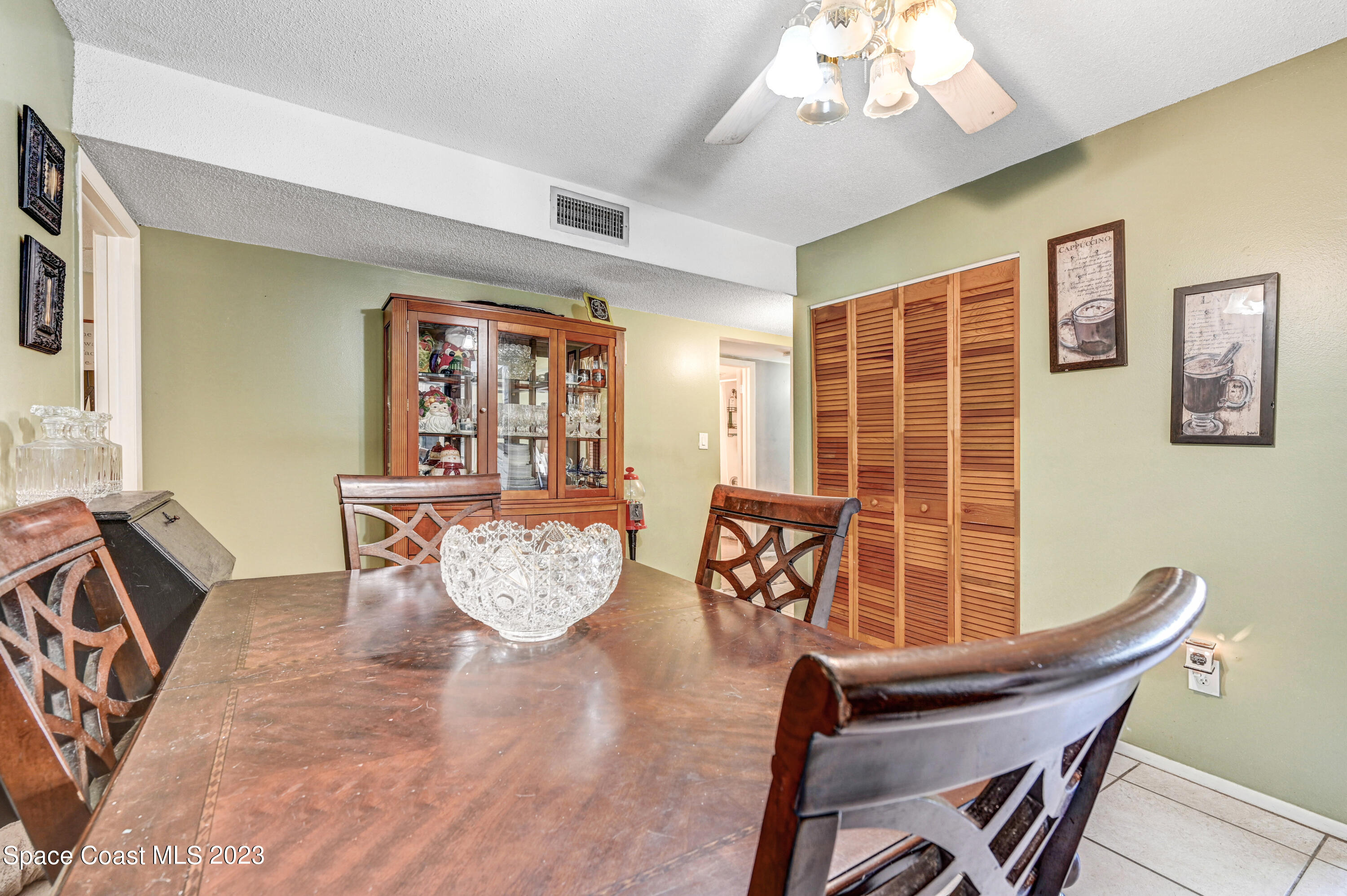 832 Damask Street Northeast Palm Bay, FL 32905 - Photo 12 of 18 a living room with furniture and a large window