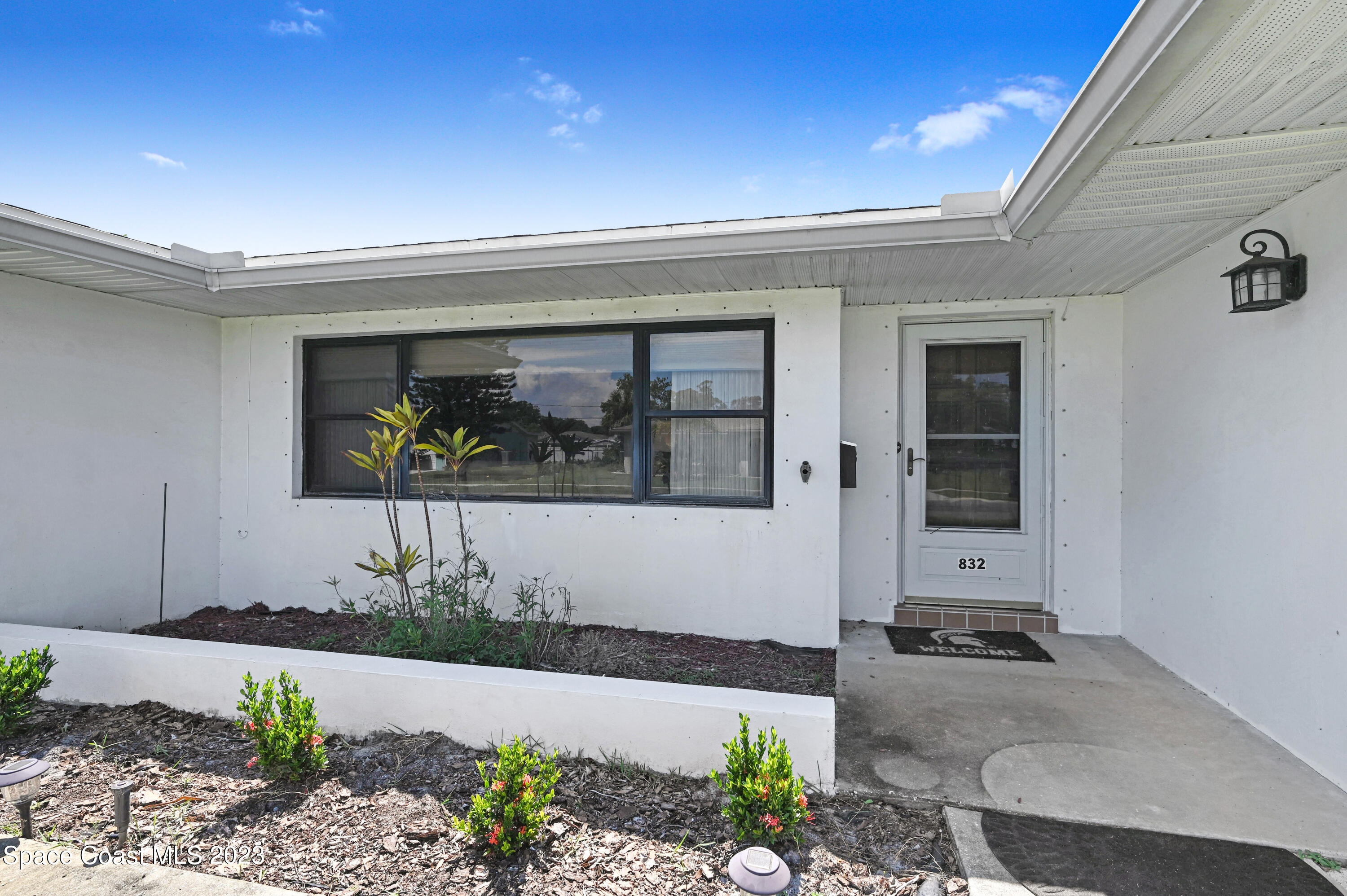 832 Damask Street Northeast Palm Bay, FL 32905 - Photo 2 of 18 a front view of a house