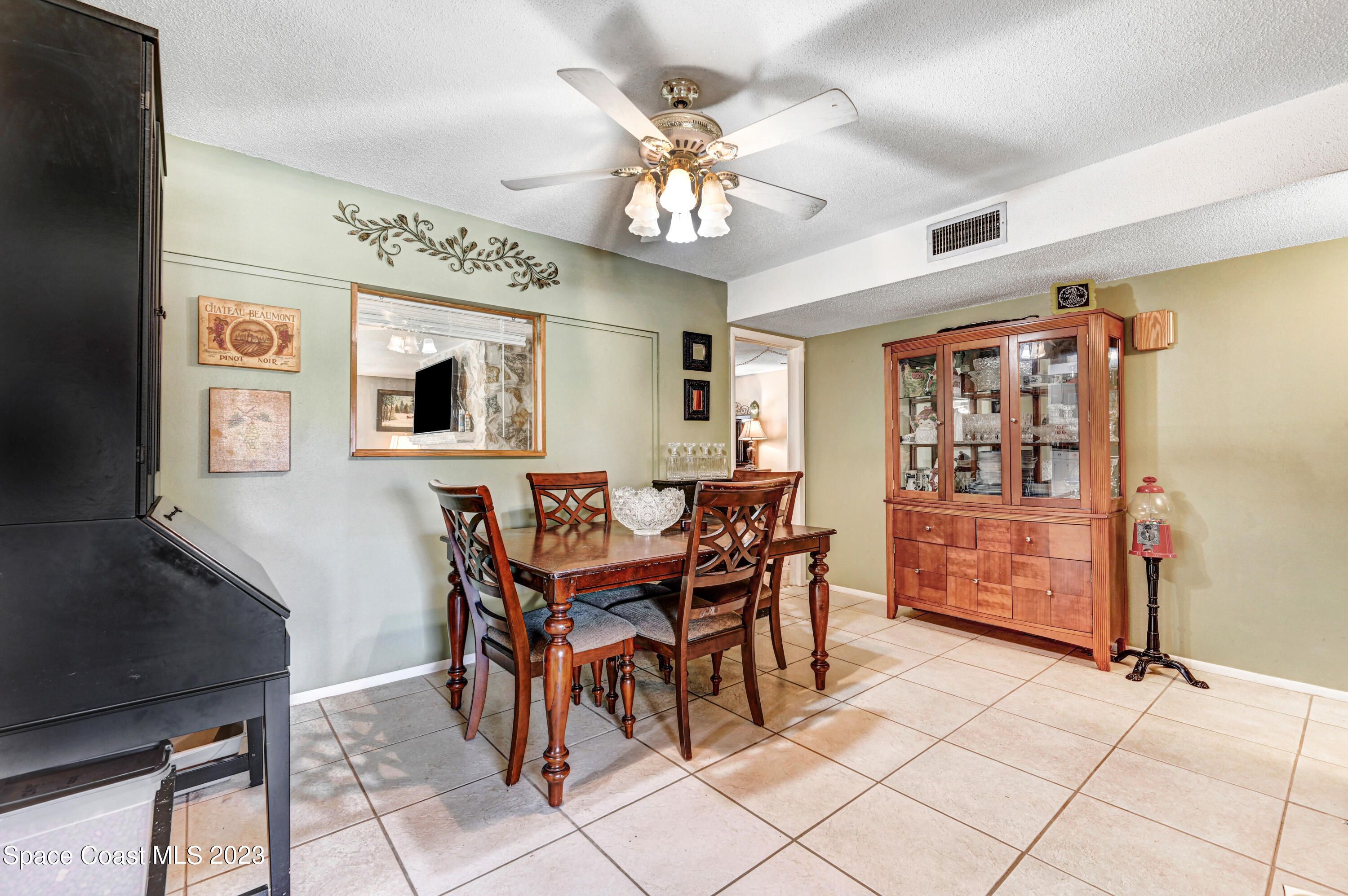 832 Damask Street Northeast Palm Bay, FL 32905 - Photo 6 of 18 a dining room with furniture and window