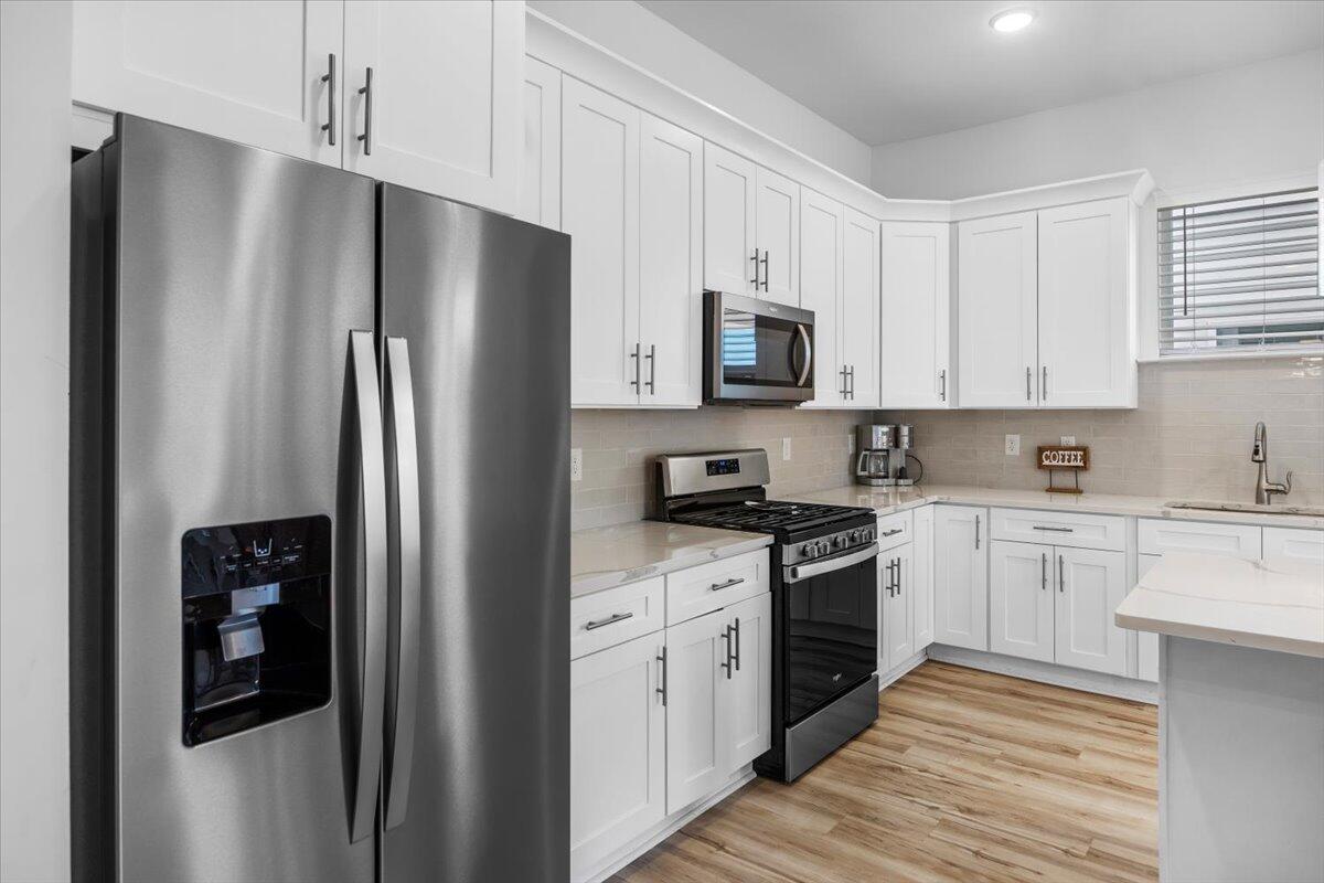 12 Caba Cove Santa Rosa Beach, FL 32459 - Photo 12 of 37 a kitchen with stainless steel appliances a refrigerator stove and sink