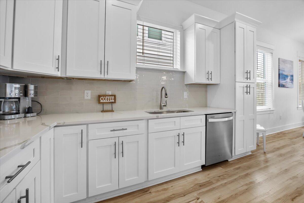 12 Caba Cove Santa Rosa Beach, FL 32459 - Photo 13 of 37 a kitchen with stainless steel appliances granite countertop white cabinets granite counter tops and a hard wood floors