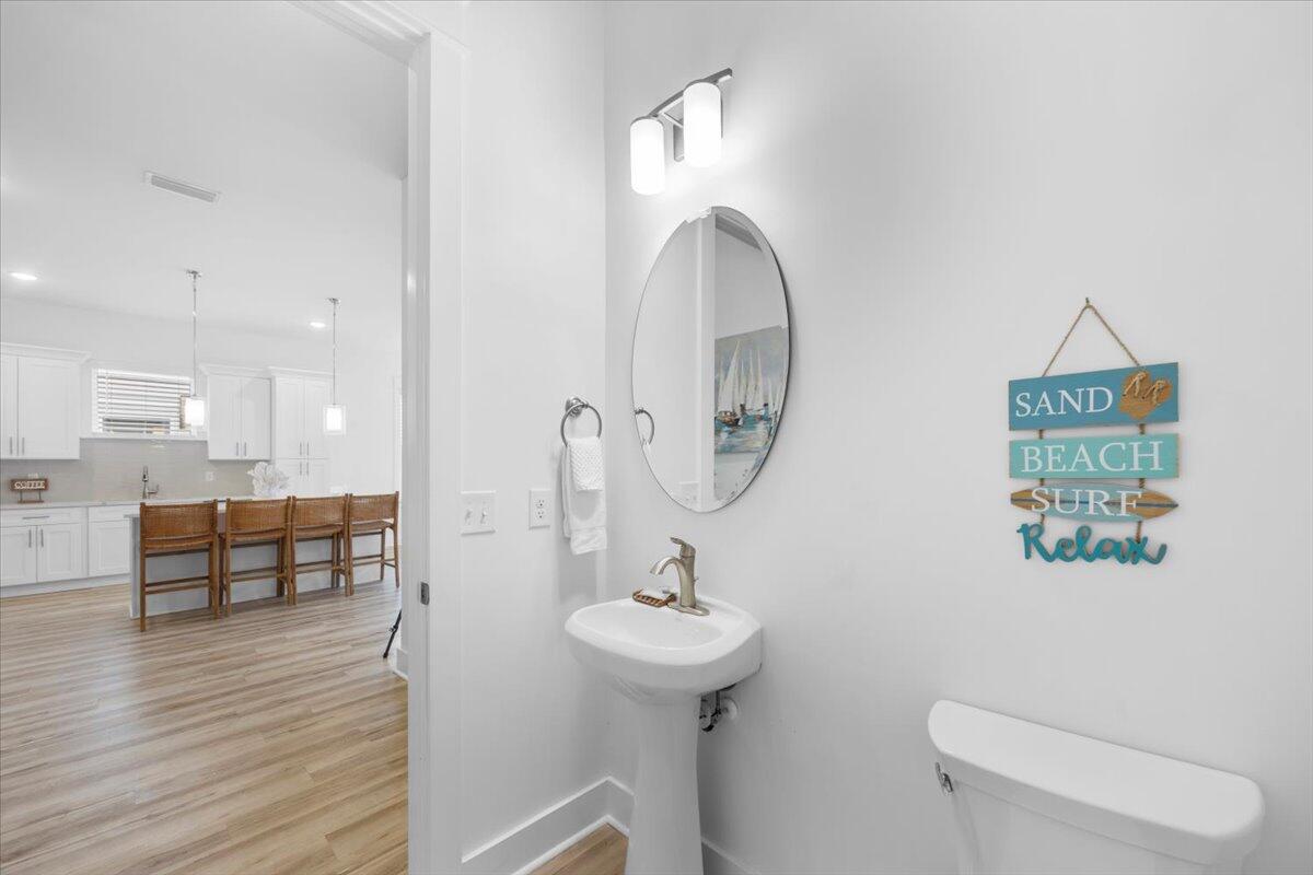 12 Caba Cove Santa Rosa Beach, FL 32459 - Photo 15 of 37 a bathroom with a toilet sink and mirror