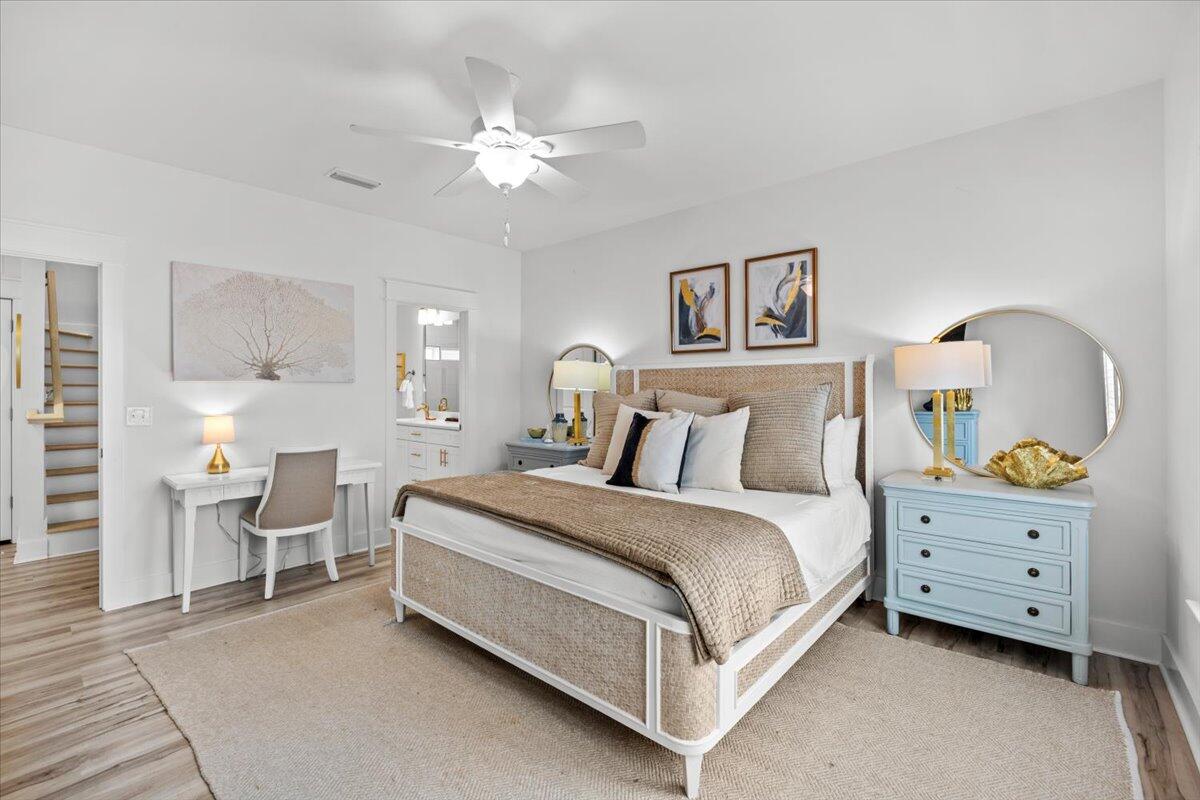 12 Caba Cove Santa Rosa Beach, FL 32459 - Photo 23 of 37 a spacious bedroom with a bed and a chandelier