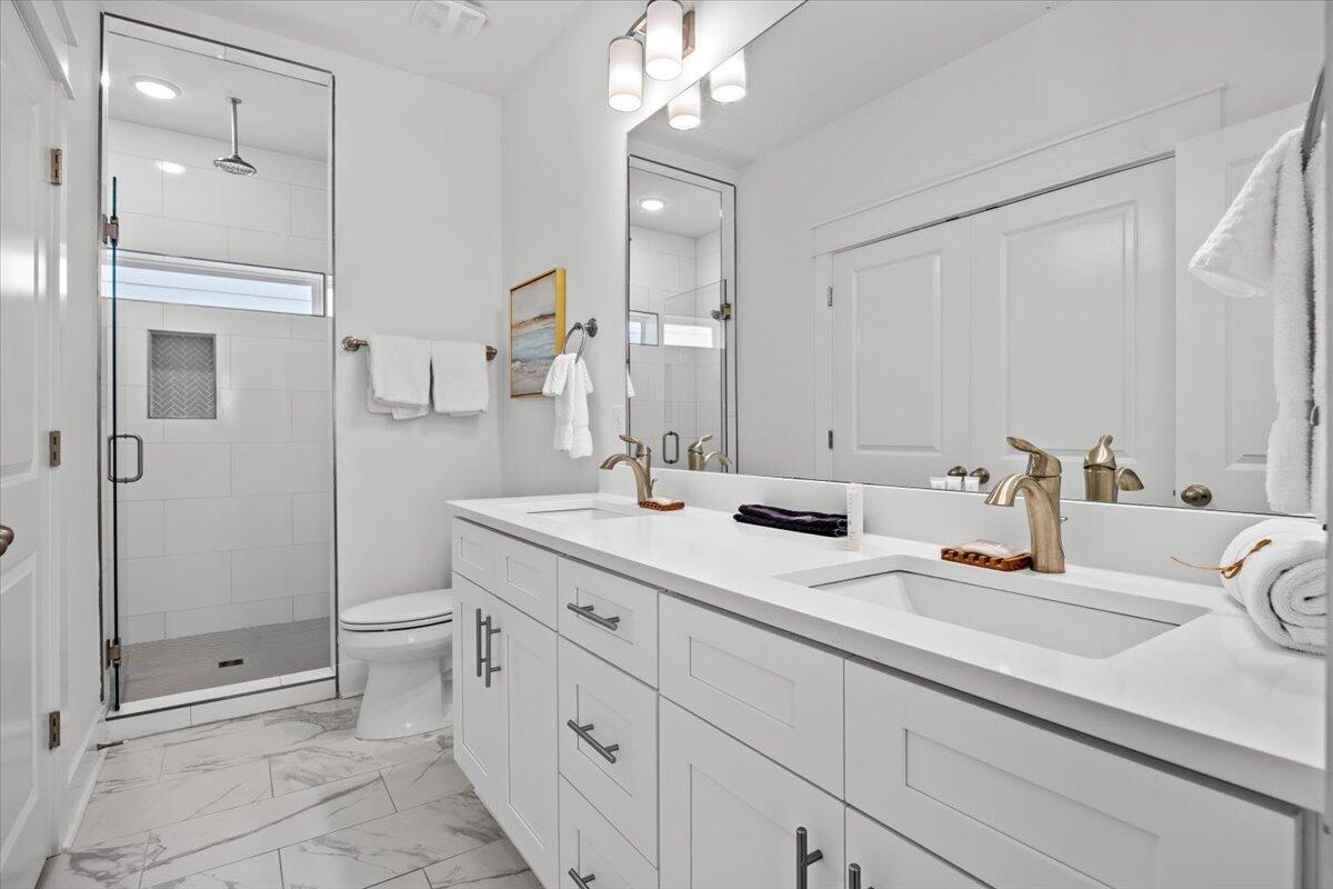 12 Caba Cove Santa Rosa Beach, FL 32459 - Photo 25 of 37 a bathroom with a sink a toilet and shower