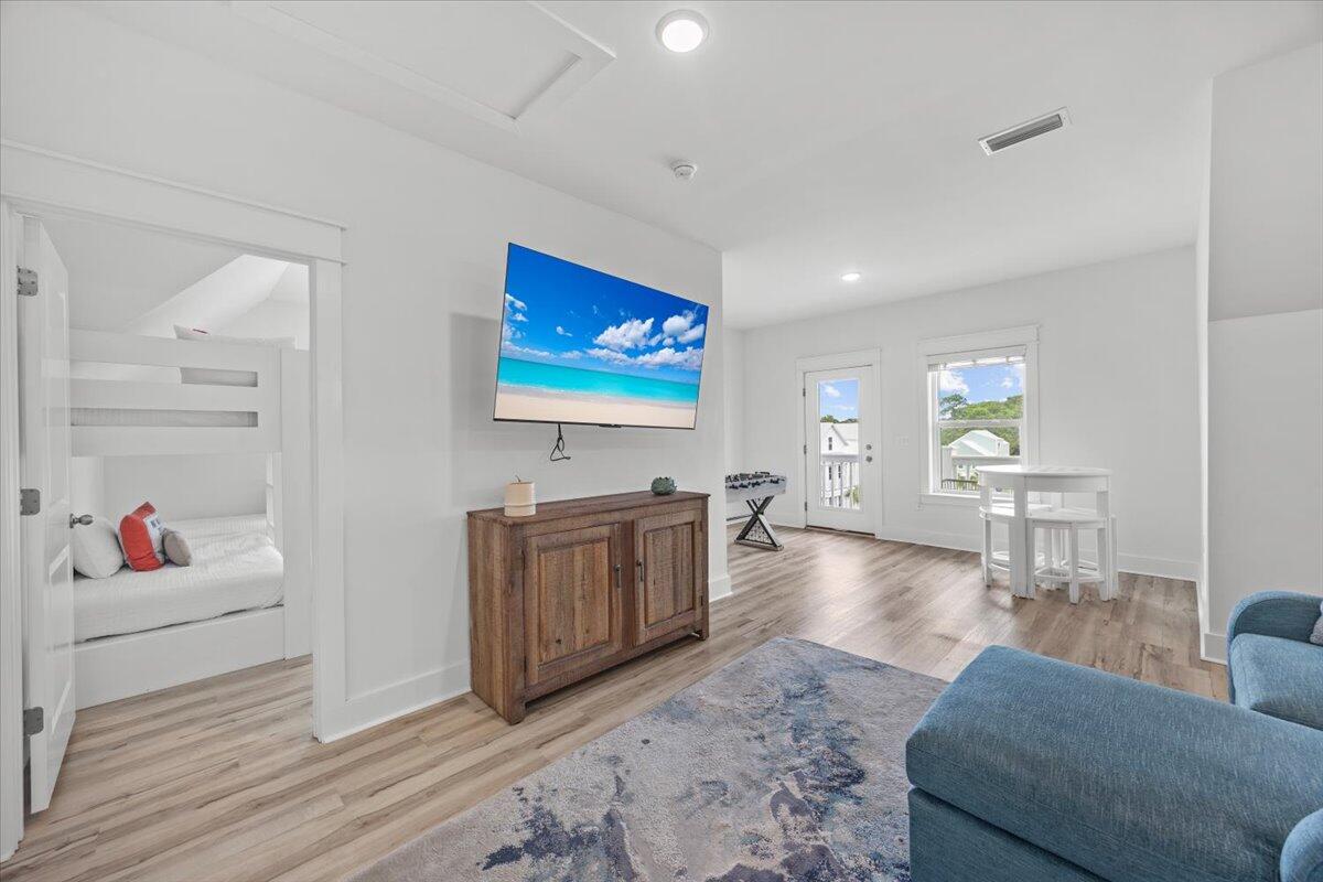 12 Caba Cove Santa Rosa Beach, FL 32459 - Photo 27 of 37 a living room with furniture and a flat screen tv