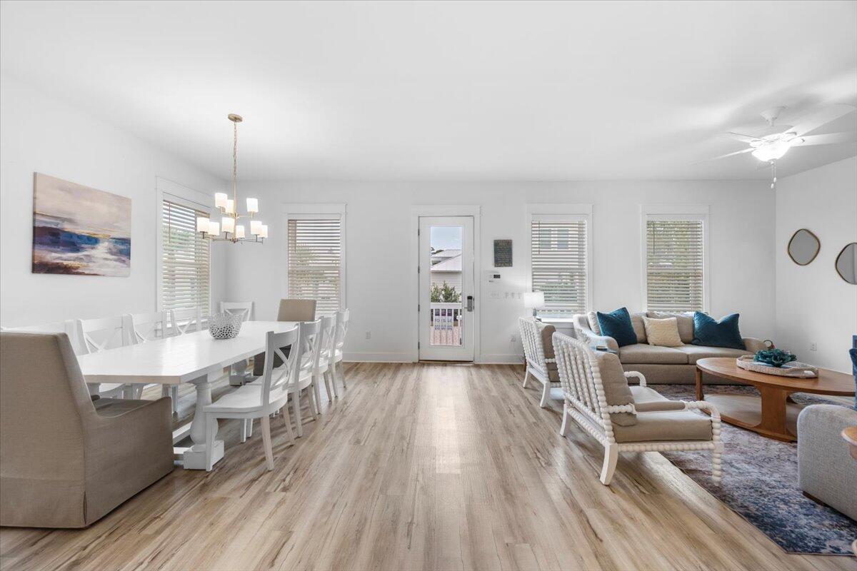 12 Caba Cove Santa Rosa Beach, FL 32459 - Photo 7 of 37 a view of a dining room with furniture window and wooden floor