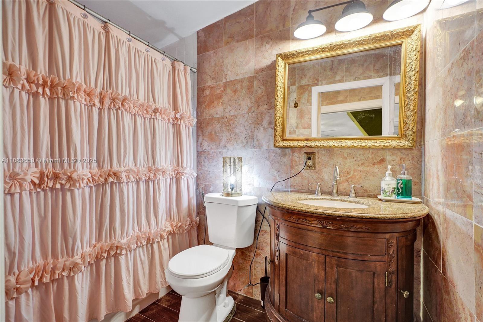 9156 Northwest 3rd Avenue Miami, FL 33150 - Photo 15 of 26 a bathroom with a sink toilet and shower