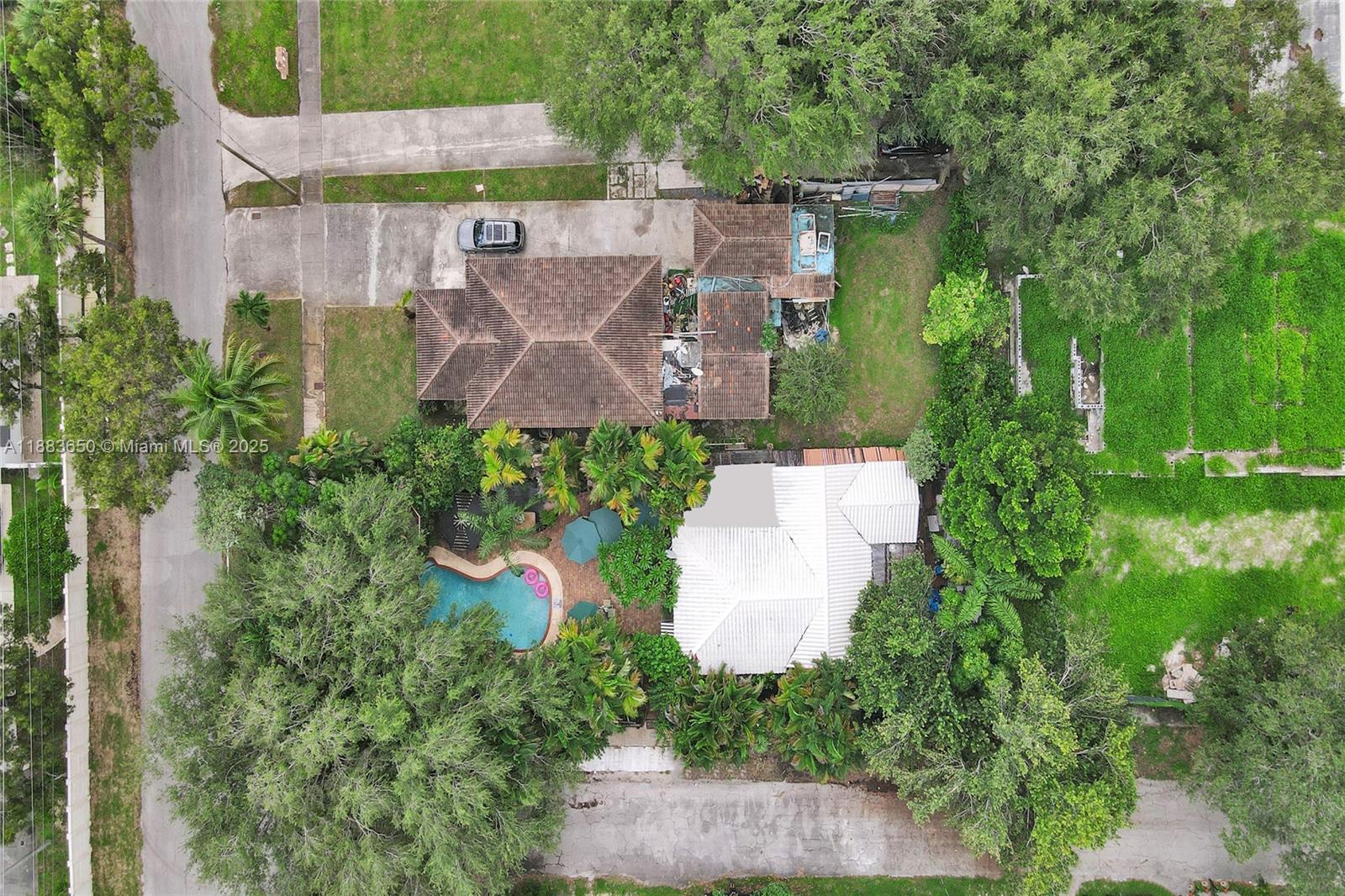 9156 Northwest 3rd Avenue Miami, FL 33150 - Photo 20 of 26 an aerial view of a house with a garden and a yard