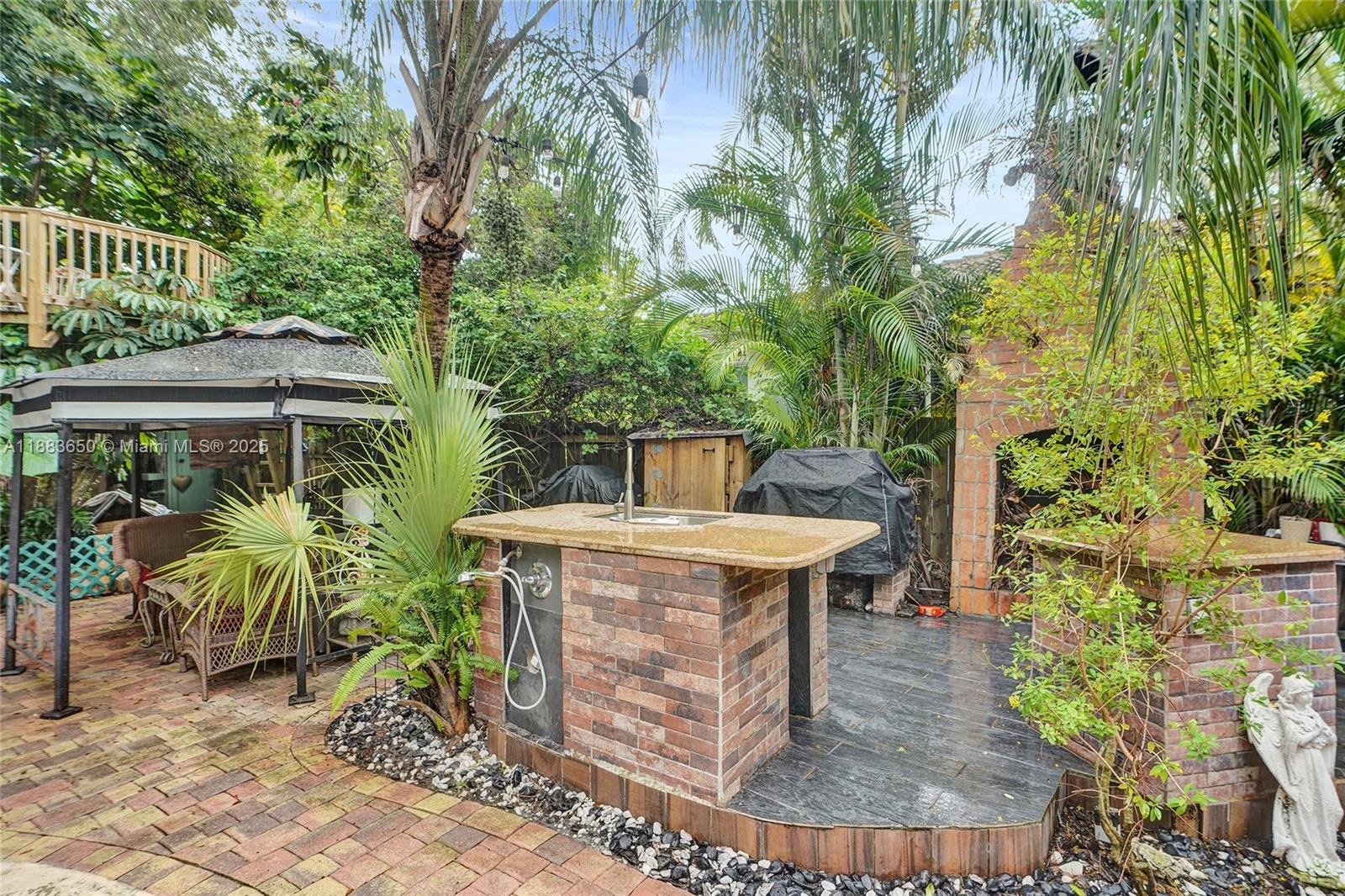 9156 Northwest 3rd Avenue Miami, FL 33150 - Photo 21 of 26 an outdoor space with seating