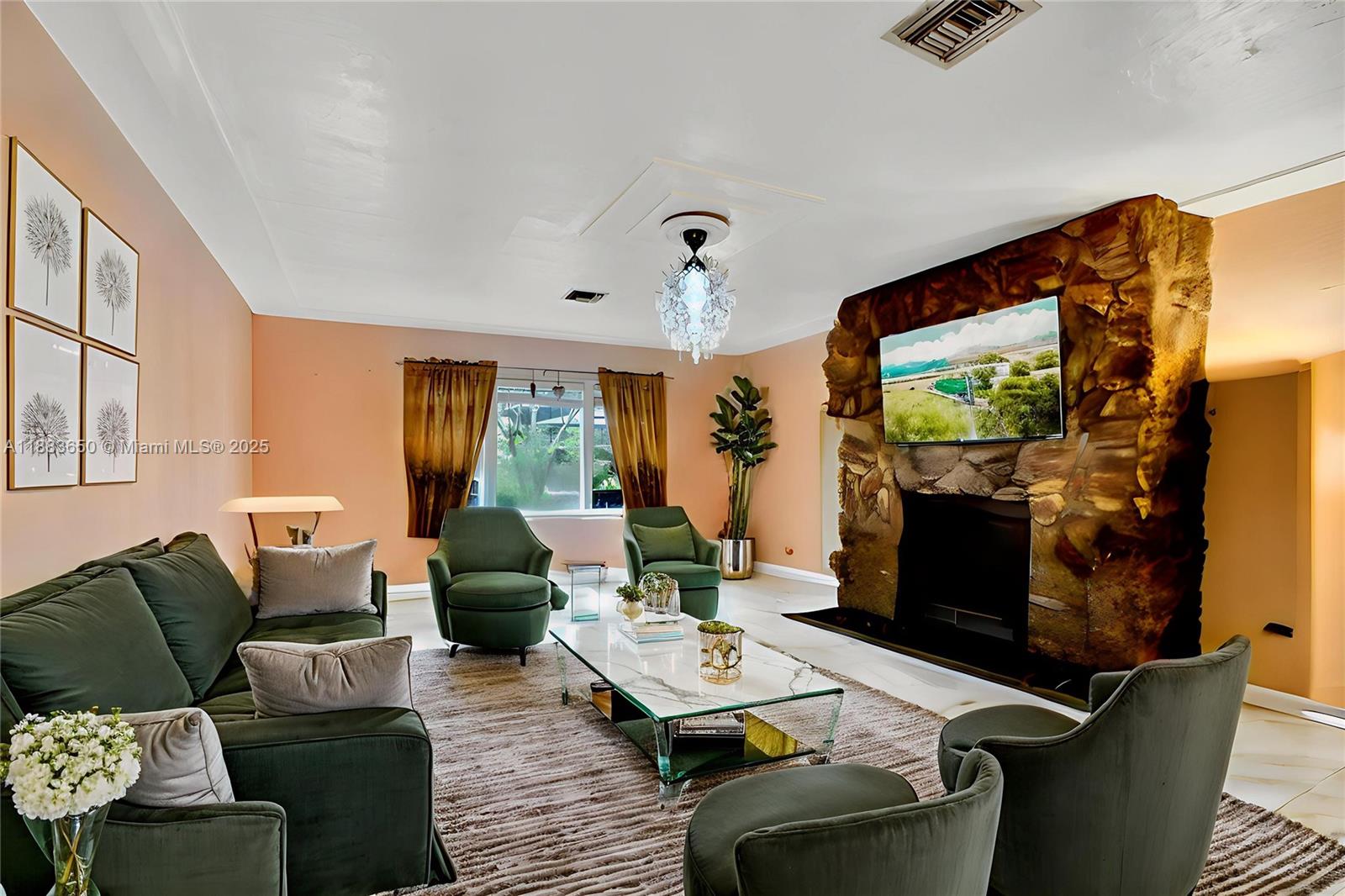 9156 Northwest 3rd Avenue Miami, FL 33150 - Photo 4 of 26 a living room with furniture and a flat screen tv