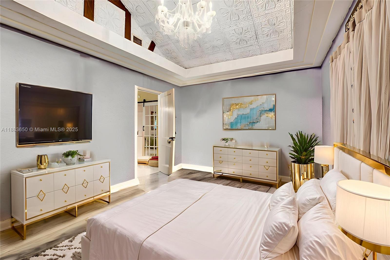 9156 Northwest 3rd Avenue Miami, FL 33150 - Photo 9 of 26 a bedroom with a bed and a flat screen tv