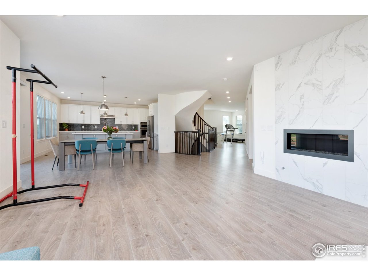2159 Summerlin Lane Longmont, CO 80503 - Photo 14 of 37 a living room with furniture and a wooden floor