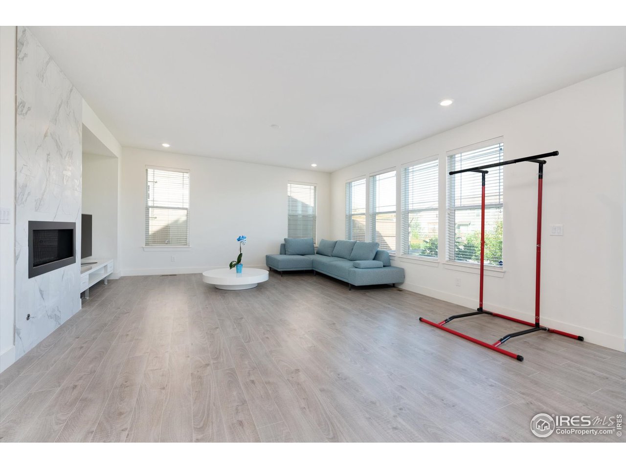2159 Summerlin Lane Longmont, CO 80503 - Photo 16 of 37 a living room with furniture window and wooden floor