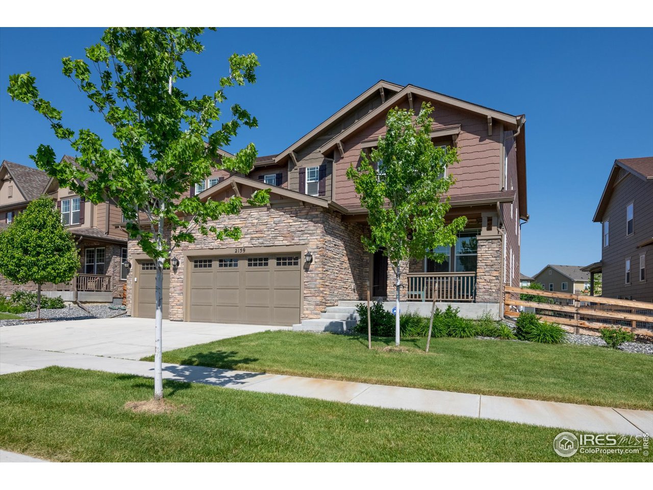2159 Summerlin Lane Longmont, CO 80503 - Photo 2 of 37 a front view of a house with a yard