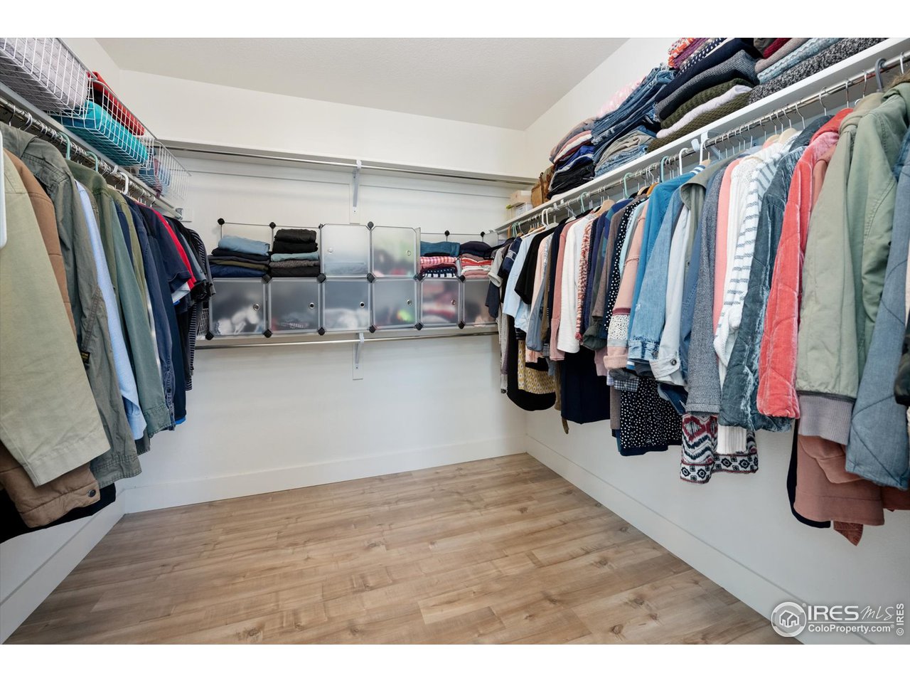2159 Summerlin Lane Longmont, CO 80503 - Photo 23 of 37 a view of walk in closet with clothes and shoes