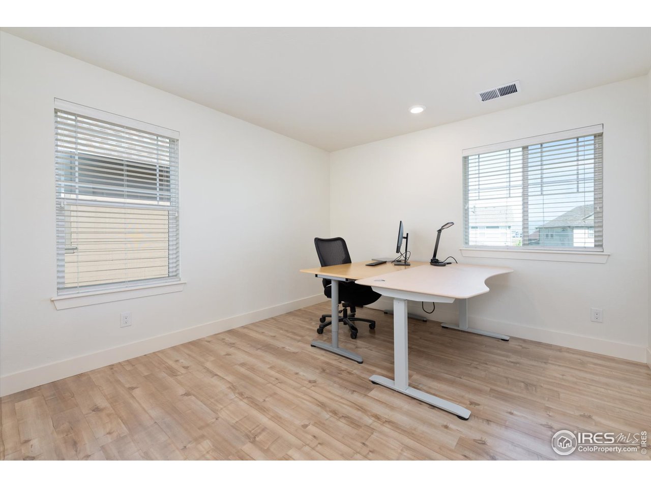 2159 Summerlin Lane Longmont, CO 80503 - Photo 26 of 37 a workspace with wooden floor and a window